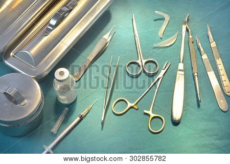 Surgical Instruments, Silicone Nasal Implant And Silicone Chin Implants In Operating Room.
