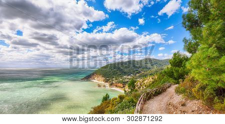 Picturesque Islets Faraglioni Di Puglia In Summer Adriatic Sea Bay Baia Delle Zagare. Mattinata Fara