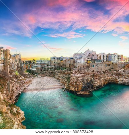 Sunset At Cala Paura Gulf With Bastione Di Santo Stefano And Lama Monachile Beach In Background. Pol