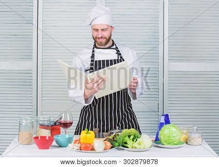 Guy Read Book Recipes. Culinary Arts Concept. Man Learn Recipe. Improve Cooking Skill. Book Family R