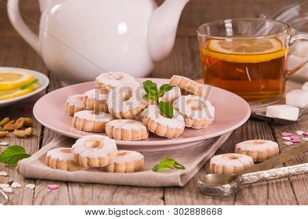 Canestrelli Biscuits With Mint On White Dish.