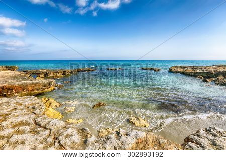 Picturesque Seascape With White Rocky Cliffs, Sea Bay, Islets And Faraglioni Near By Conca Specchiul