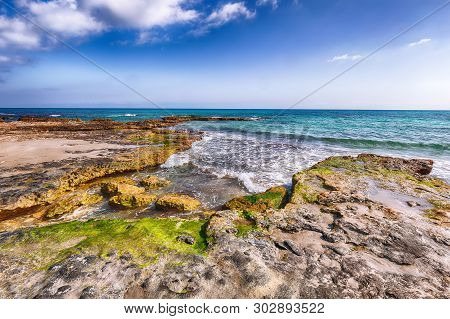 Picturesque Seascape With White Rocky Cliffs, Sea Bay, Islets And Faraglioni Near By Conca Specchiul