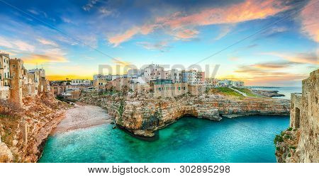 Sunset At Cala Paura Gulf With Bastione Di Santo Stefano And Lama Monachile Beach In Background. Pol