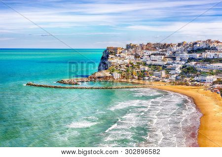 Picturesque Peschici With Wide Sandy Beach In Puglia, Adriatic Coast Of Italy. Location Peschici, Ga