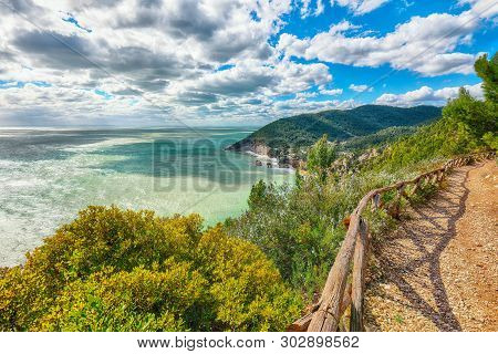 Picturesque Islets Faraglioni Di Puglia In Summer Adriatic Sea Bay Baia Delle Zagare. Mattinata Fara