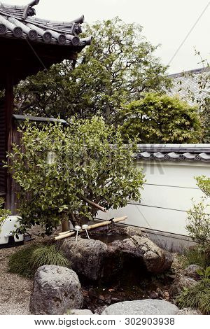 Kyoto, Japan - April 16th, 2018: Small Garden In The Byodoin Complex In The Town Of Uji.  Kyoto, Jap