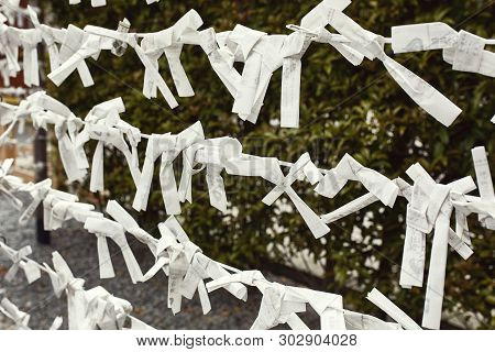 Kyoto, Japan - April 16th, 2018: Omikuji Fortunes On Display At The Fushimi Inari-taisha Shrine In K