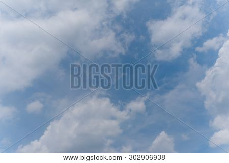Beautiful Bright Blue Sky With White Fluffy Clouds On A Clear Sunny Day. Royalty High-quality Free S