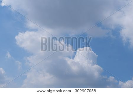 Beautiful Bright Blue Sky With White Fluffy Clouds On A Clear Sunny Day. Royalty High-quality Free S