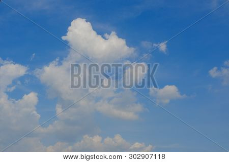 Beautiful Bright Blue Sky With White Fluffy Clouds On A Clear Sunny Day. Royalty High-quality Free S