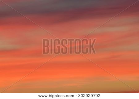 View Of The Evening Pink Sunset In Summer With Gray And Beautiful Clouds In The Foothills Of The Nor