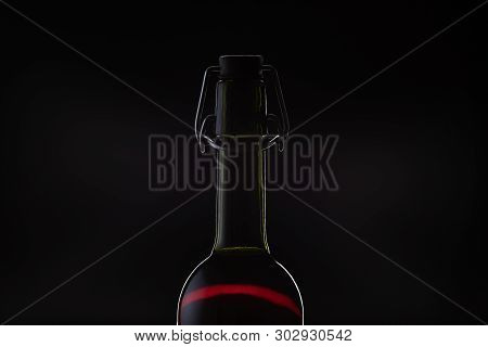 Rose Wine. Red Wine In Bottle And Metal Opener On Cork. Dark Background. Silhouette