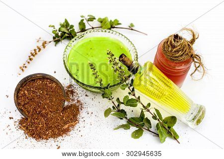 Tulsi Face Pack Isolated On White Consisting Of Sandal Wood Powder Well Mixed With Tulsi Leaves With