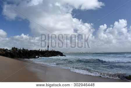 Buddina, Australia - Apr 21, 2019. People Relaxing On Buddina Beach Breakwall (sunshine Coast, Queen