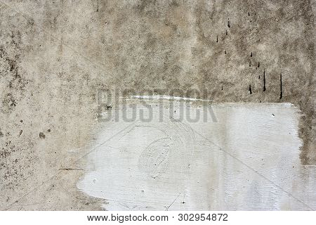 Concrete Wall Fragment. Old Dirty Cement Texture With Defects. Grunge Surface With Cracks And Weathe