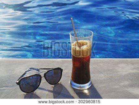 Freddo Espresso Coffee With Sunglasses In Front Of A Pool - Cold Coffee - Summer Vacation