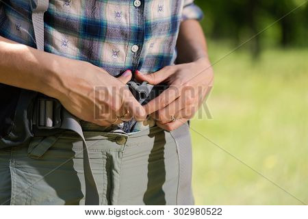 Woman Hands Fix Faxtex On Waist Backpack