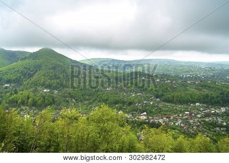 Panoramic View Of Village In Spring Mountain Forest. Kosiv, Ukraine