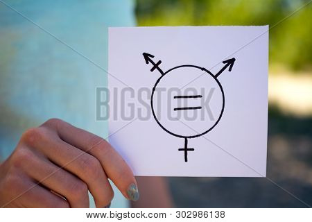 Gender Definition Concept, A Piece Of Paper With A Transgender Symbol In Hand