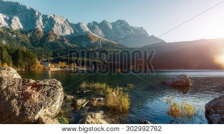 Awesome Alpine Highlands In Sunny Day. Nature Landscape. The Eibsee Lake In Front Of The Zugspitze U
