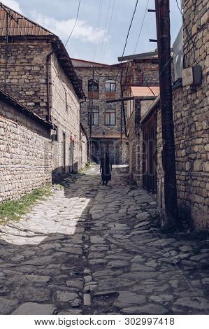 Lahich, Azerbaijan, May 02, 2015: Old Azerbaijan Woman Is Walking On The Street