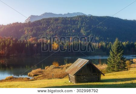 Wonderful Misty Landscape At Germanian Alps. Colrful Clouds On Blue Sky Over The Karwendel Mountains