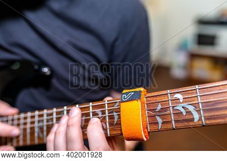 Miercurea Ciuc, Romania- 05 January 2021: Young Musician Playing On Ibanez Guitar Using A Gruvgear F