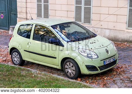 Versailles, France - September 15, 2019: Green Compact Car Renault Twingo In The City Street.