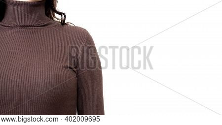 Young Woman Wearing Brown Sweater Or Roll-neck Close-up. Banner With Copy Space