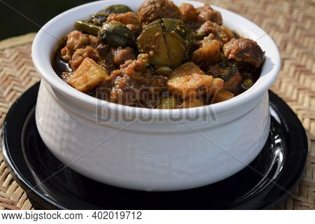 Undhiyu Or Oondhiyu Closeup Served In A White Handi Bowl Casserole. Winter Special Seasonal Festival