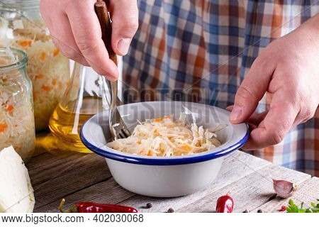 The Preparation Process Fermentation Preservation Sauerkraut On A Light Background. Natural Rustic S