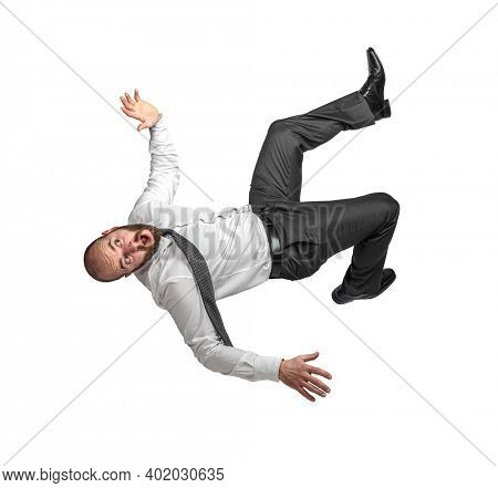 businessman falling, scared expression. isolated on white