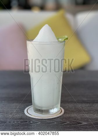 Lime Smoothie In Glass On Grey Table, Stock Photo