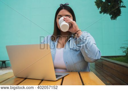 Portrait Of Young Pluse Size Woman Using