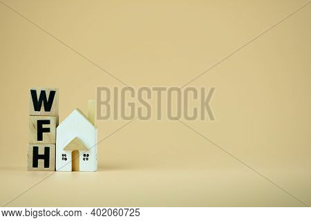 Wooden Blocks Word Of Wfh : Work From Home And Mini Home. Concept Of Work From Home During Corona Vi