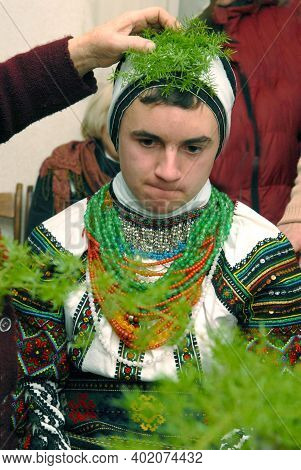 Goroshova, Ternopil Oblast, Ukraine - 14.01.2013: Young man is dressed up in Malanka costume. Malanka celebration in Goroshova village.