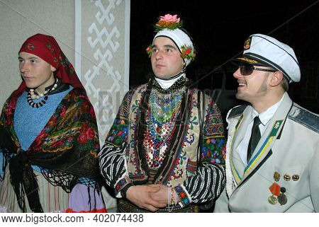 Goroshova, Ternopil Oblast, Ukraine - 14.01.2013: Young man is dressed up in Malanka costume. Malanka celebration in Goroshova village.