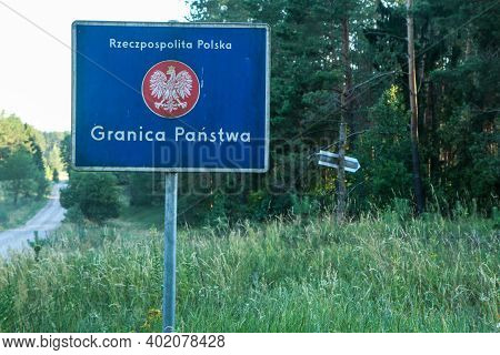 The Official Traffic Sign Giving Information About The Borders Of Poland Deep In The Forest.