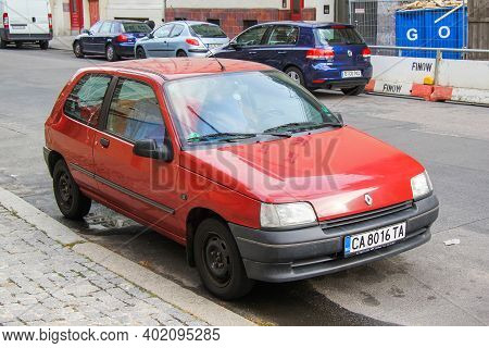 Berlin, Germany - September 12, 2013: Red Compact Car Renault Clio In The City Street.