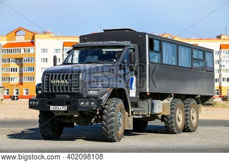Novyy Urengoy, Russia - July 25, 2017: Black Shift Bus Ural 3255 Next In The City Street.