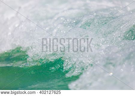 Powerful, Stormy, Foamy Waves Are Picked Up By The Wind. White Foam From Bubbles Of Different Sizes 