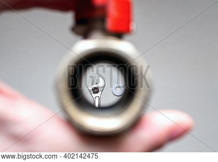 Adjustable Wrench And Fum Tape On White Background. View Through Plumbing Faucet With Red Valve