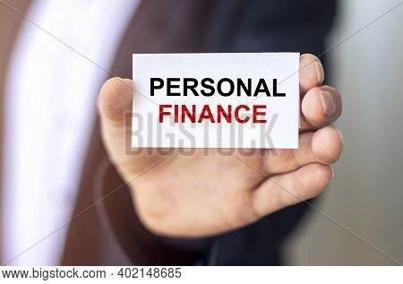 Personal Finance Inscription On White Paper In Male Hands