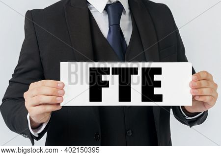 Business And Finance Concept. A Businessman Holds A Sign In His Hands Which Says Fte