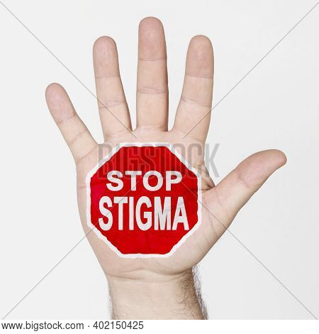 Medicine Concept. On The Palm Of The Hand There Is A Stop Sign With The Inscription - Stop Stigma. I