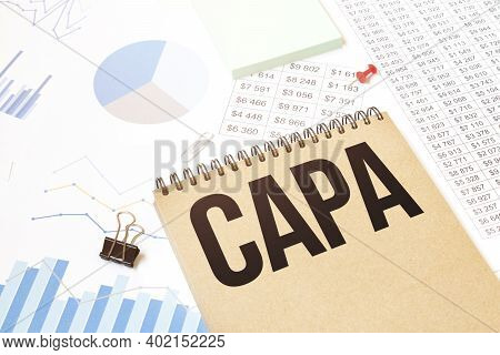 Notepad With Text Capa. Diagram And White Background