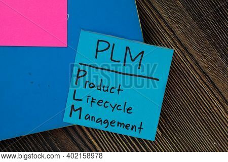 Plm - Product Lifecycle Management Write On Sticky Notes Isolated On Wooden Table.
