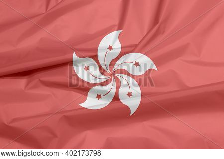 Fabric Flag Of Hong Kong. Crease Of Hong Kong Flag Background, The Red And White Five Petal Bauhinia