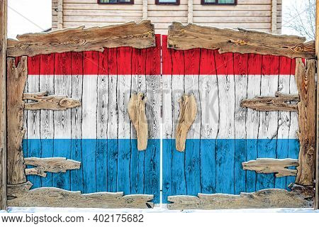 Close-up Of The National Flag Of Luxembourg  On A Wooden Gate At The Entrance To The Closed Territor